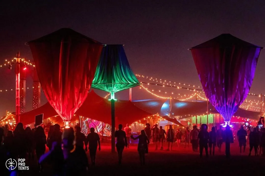 Festival stage under stretch tent at night