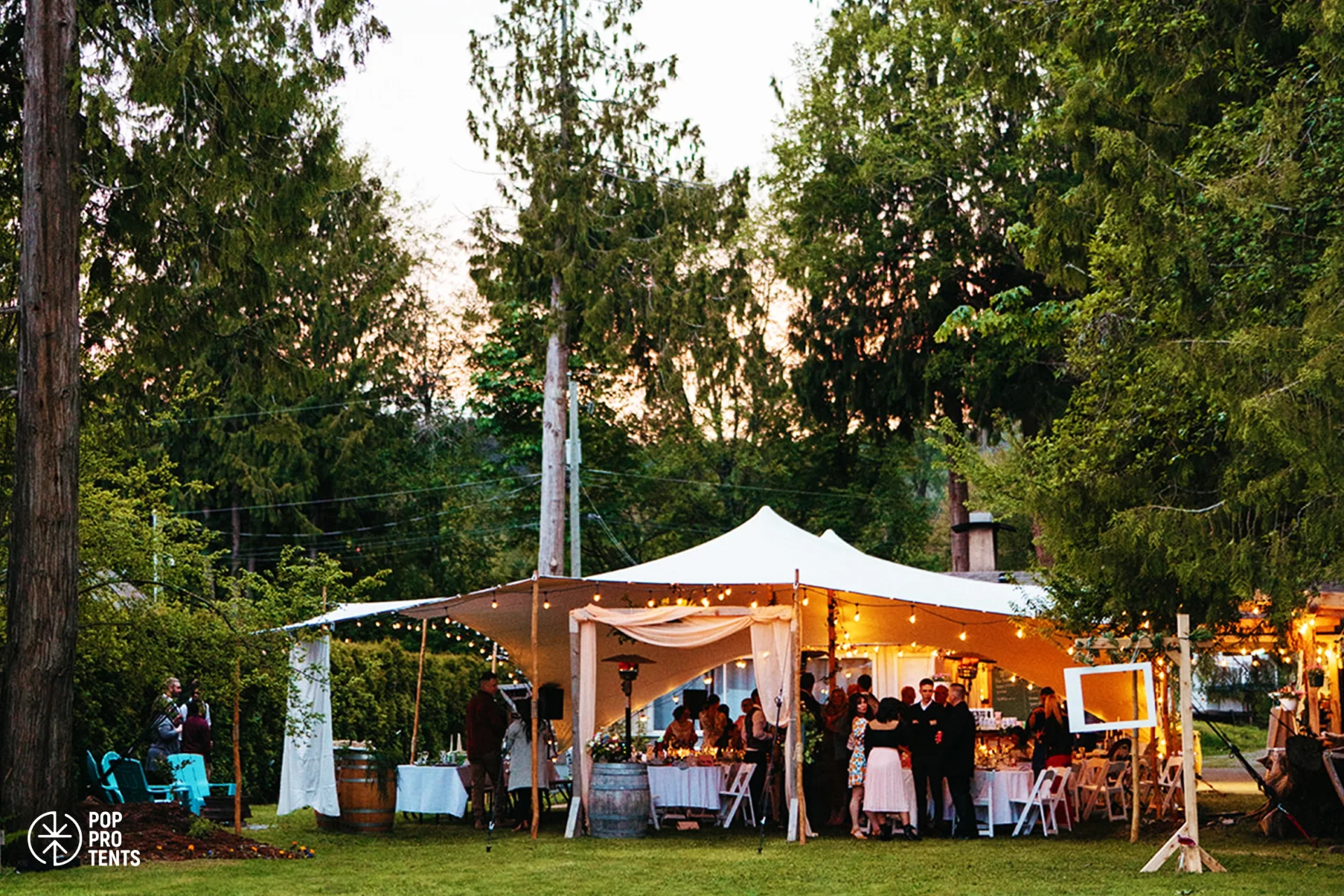 Boho wedding reception under ivory stretch tent