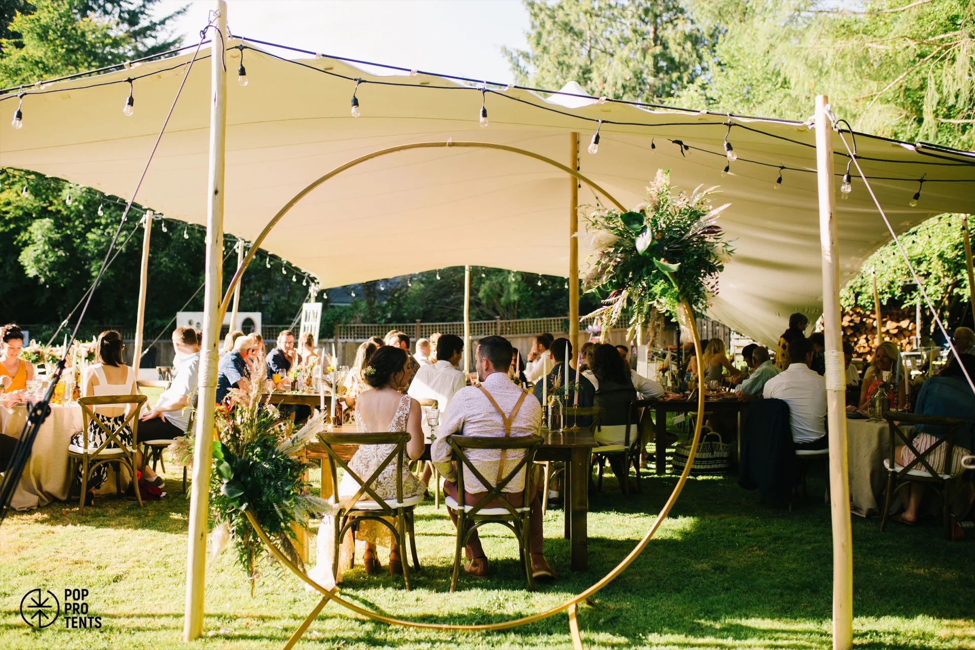 Elegant wedding reception under white stretch tent