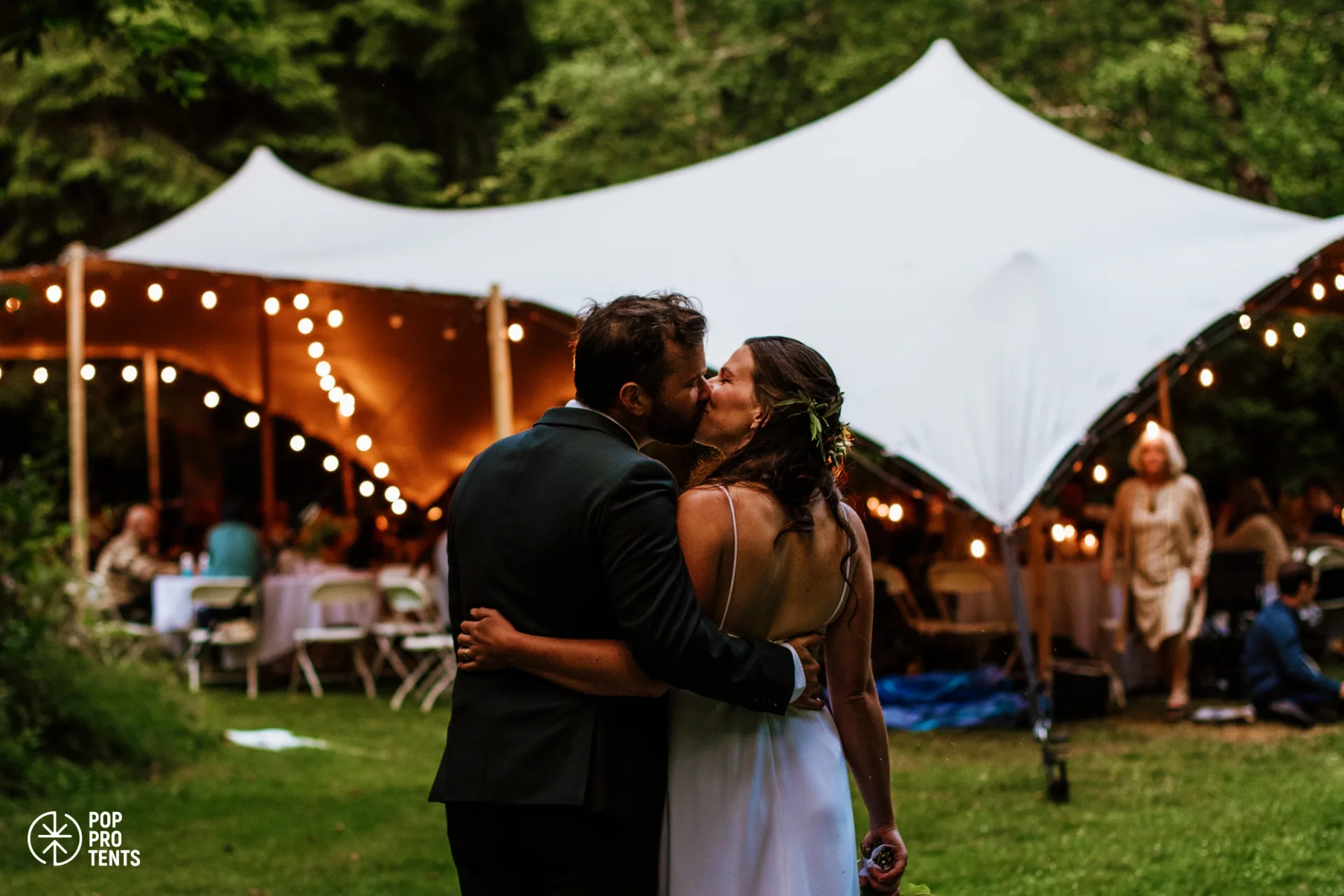 Wedding cocktail hour under draped stretch tent